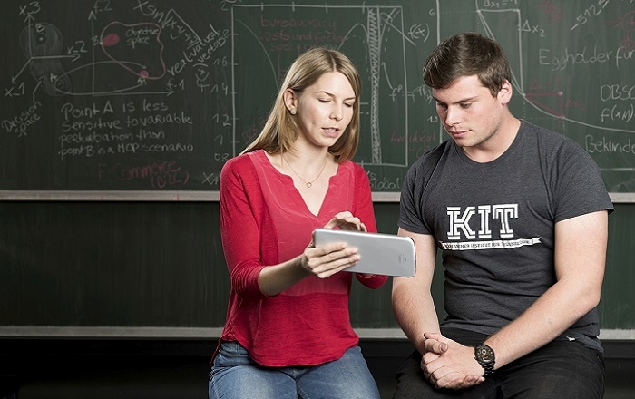 Two Students looking at a paper